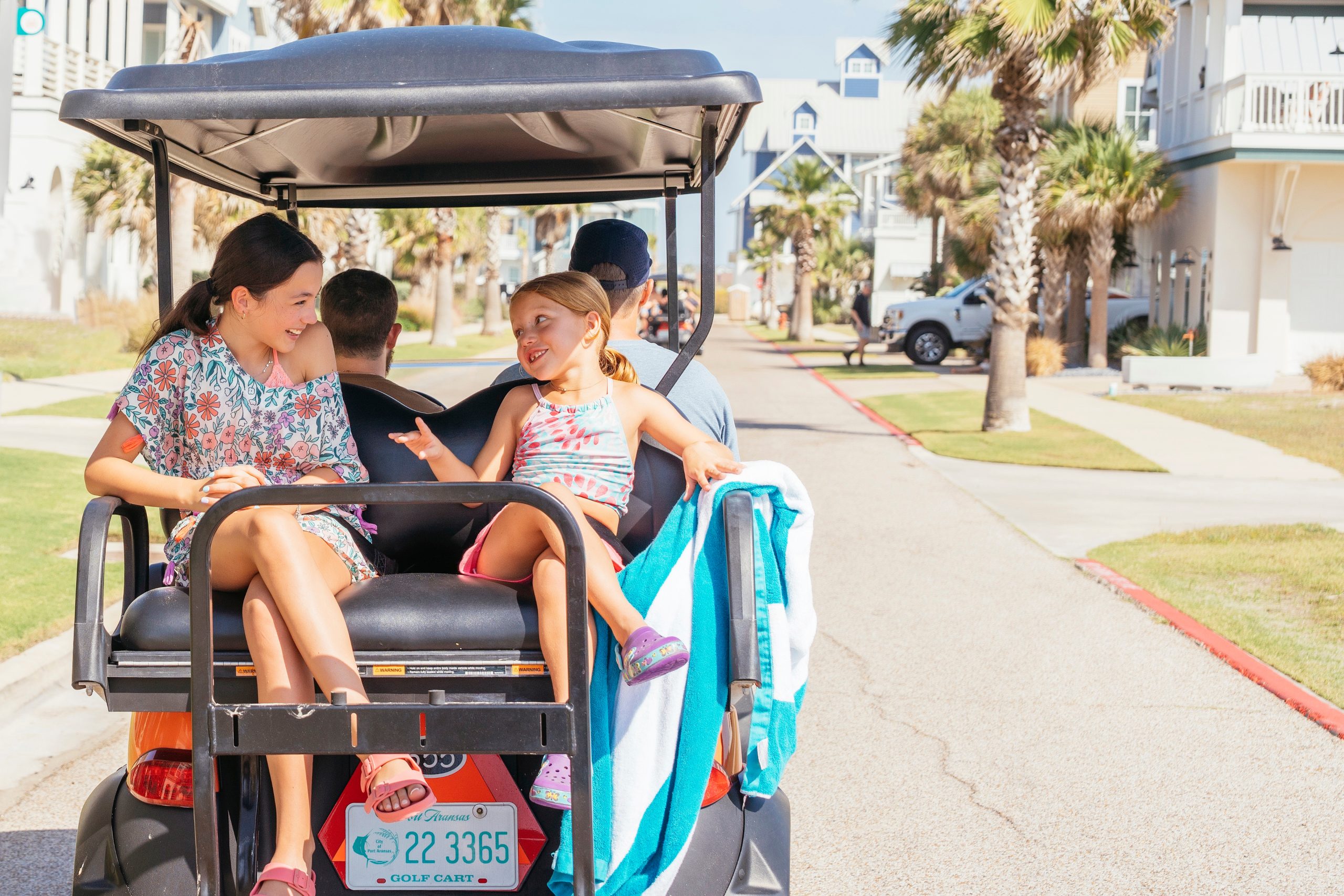 Family riding a beach cart at Palmilla Beach