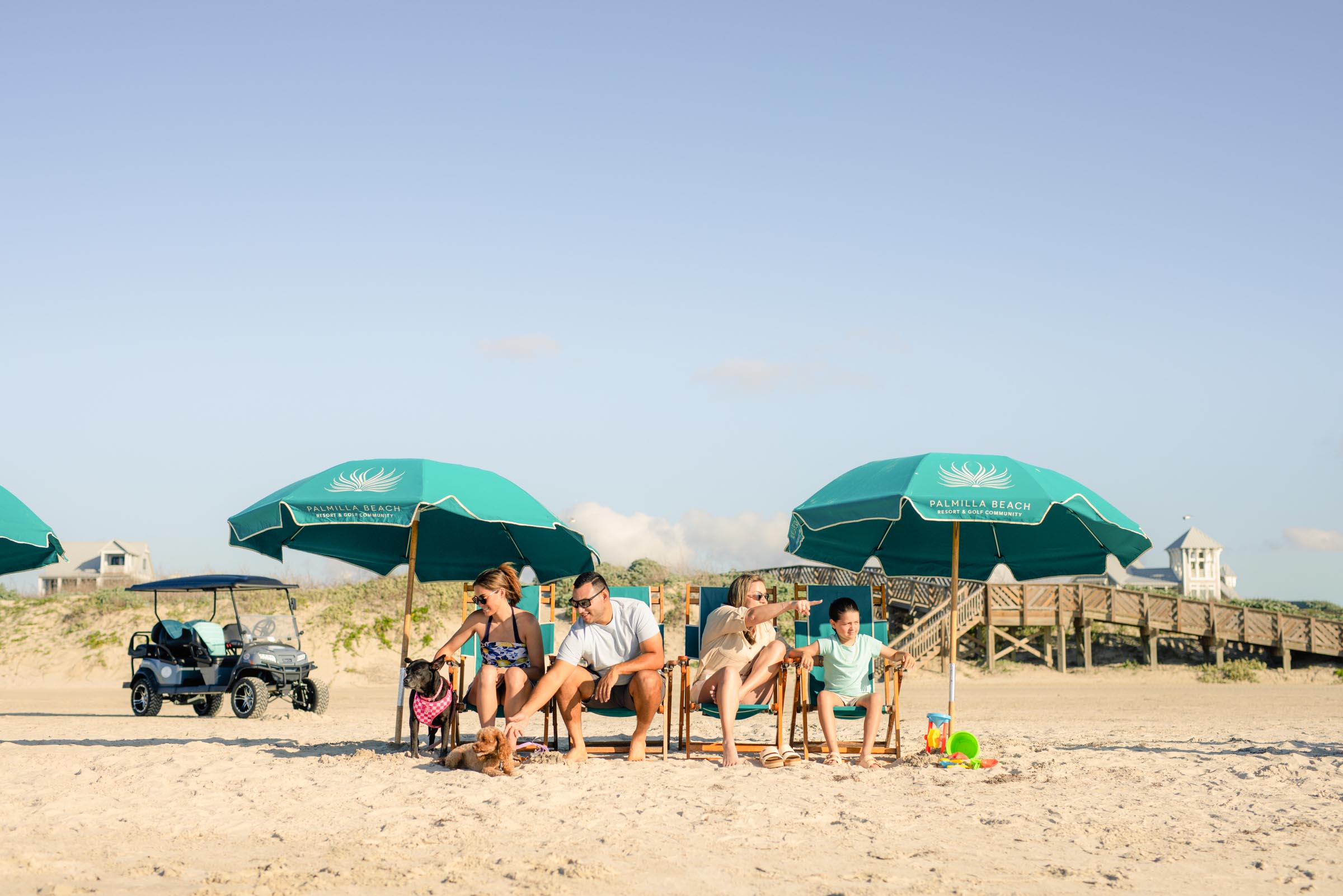 Reserved beach package with lounge chairs and umbrellas on the sand at Palmilla Beach