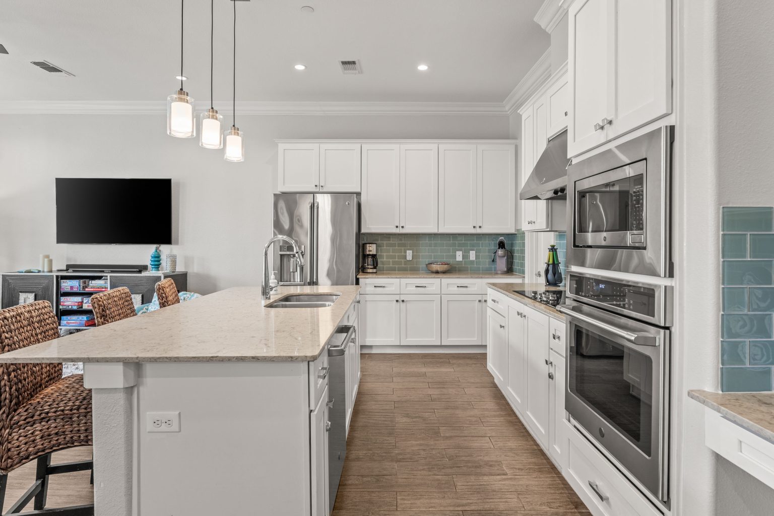 Kitchen with stainless double wall ovens and a breakfast bar at 137 Palmilla Circle #204