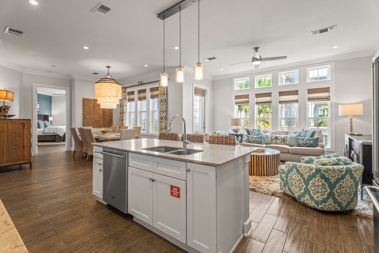 Kitchen island with sink, open to the dining and living areas at 137 Palmilla Circle #204