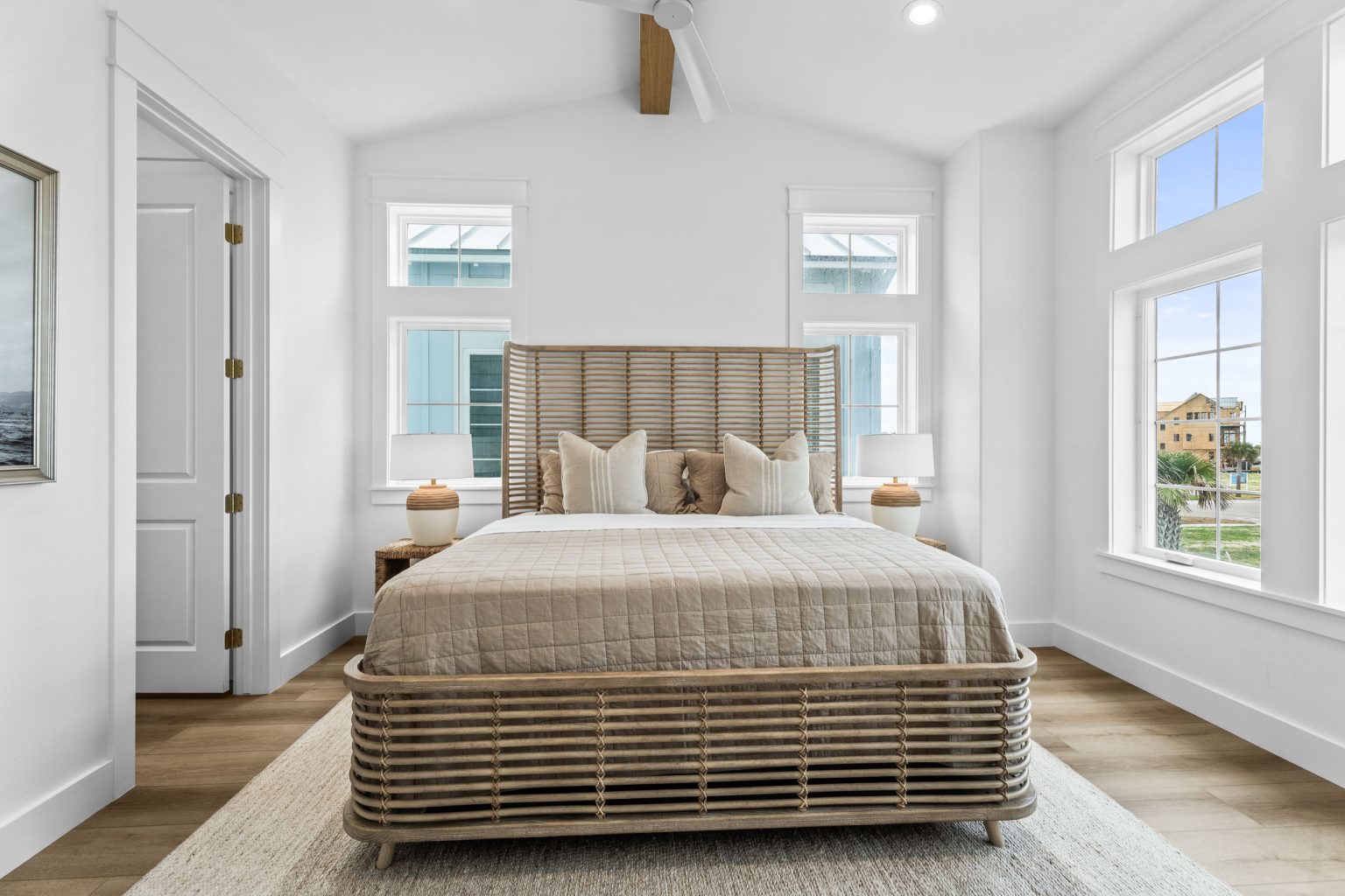 Bedroom with a rattan bed and vaulted ceiling at 209 Horse Tail Lane