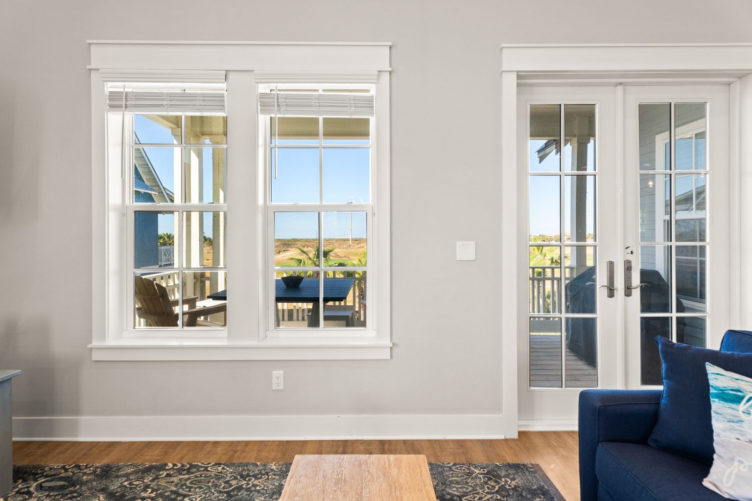 Living room windows and French doors to the porch at 200 Sunset Avenue