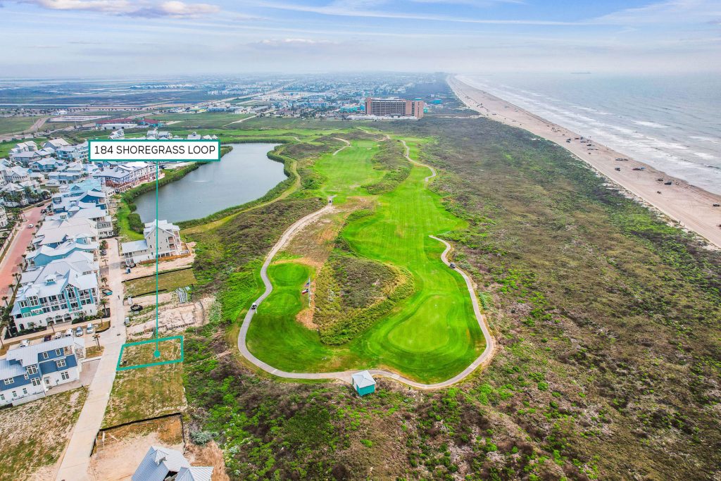 Aerial view marking the 184 Shoregrass Loop homesite between the golf course and beach