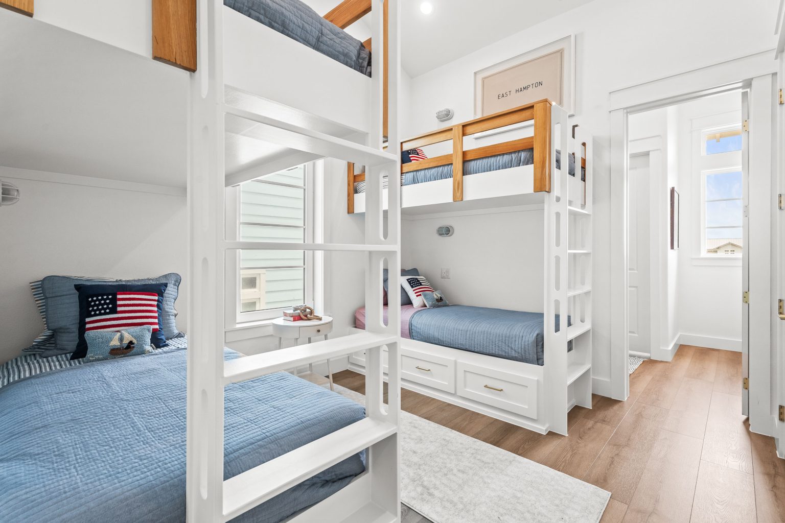 Bunk room with built-in bunk beds and blue bedding at 120 Lotus Lane