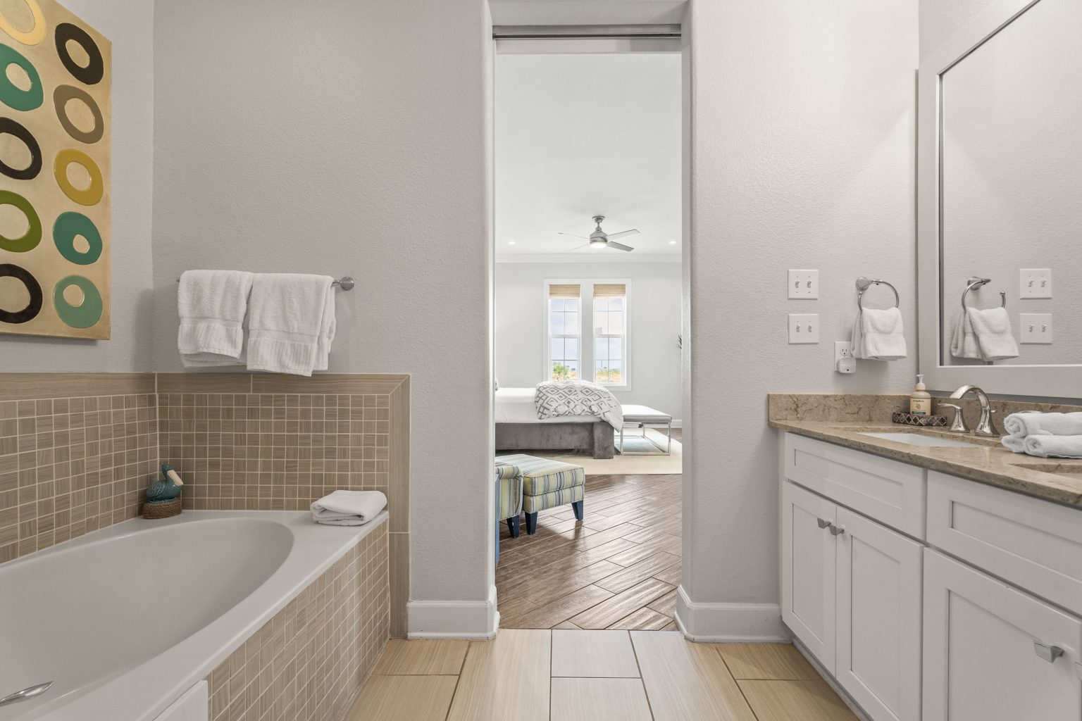 Primary bathroom with a soaking tub and vanity at 137 Palmilla Circle #204