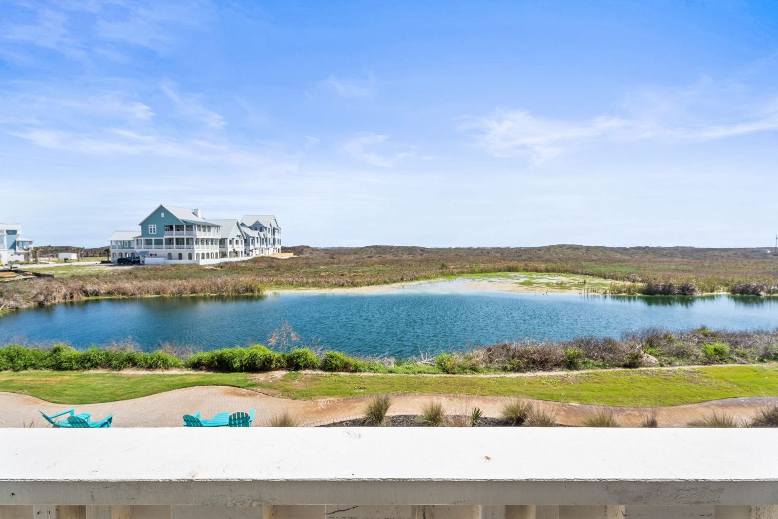 View over a pond and dunes from the porch at 250 Sunrise Avenue