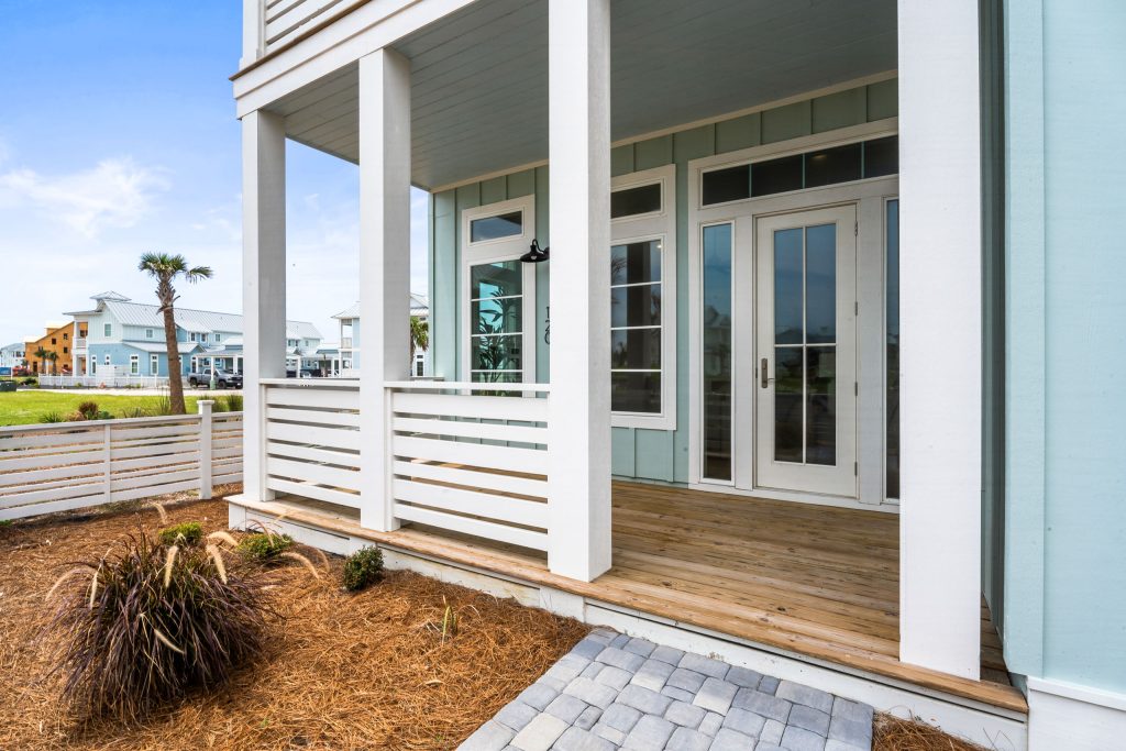 Covered front porch with French doors at 120 Lotus Lane