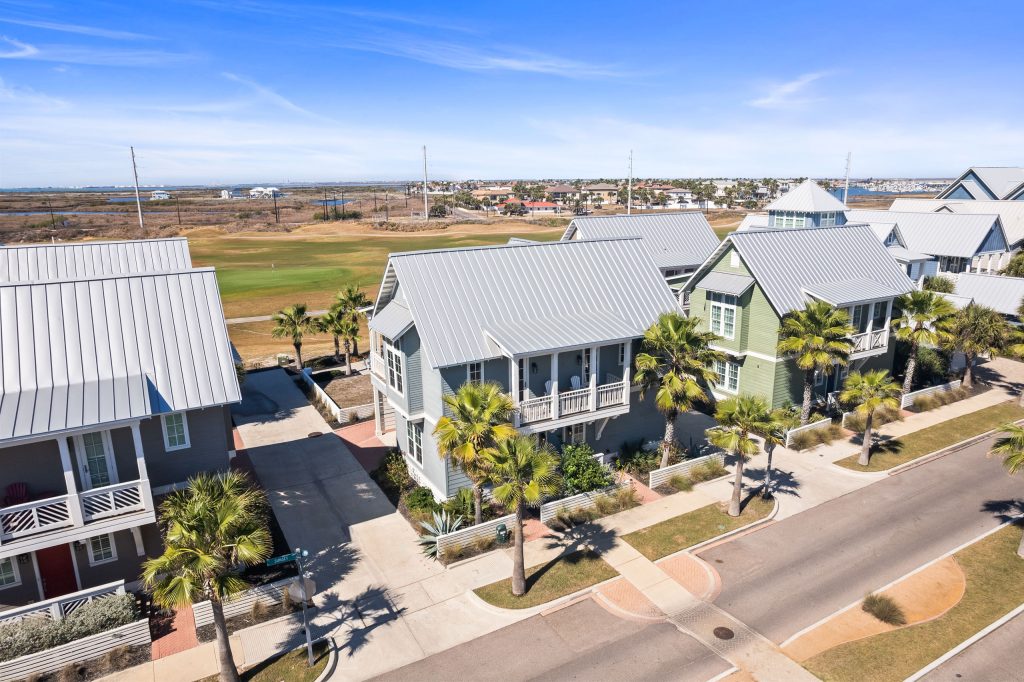 Aerial view of 200 Sunset Avenue and neighboring homes toward the golf course