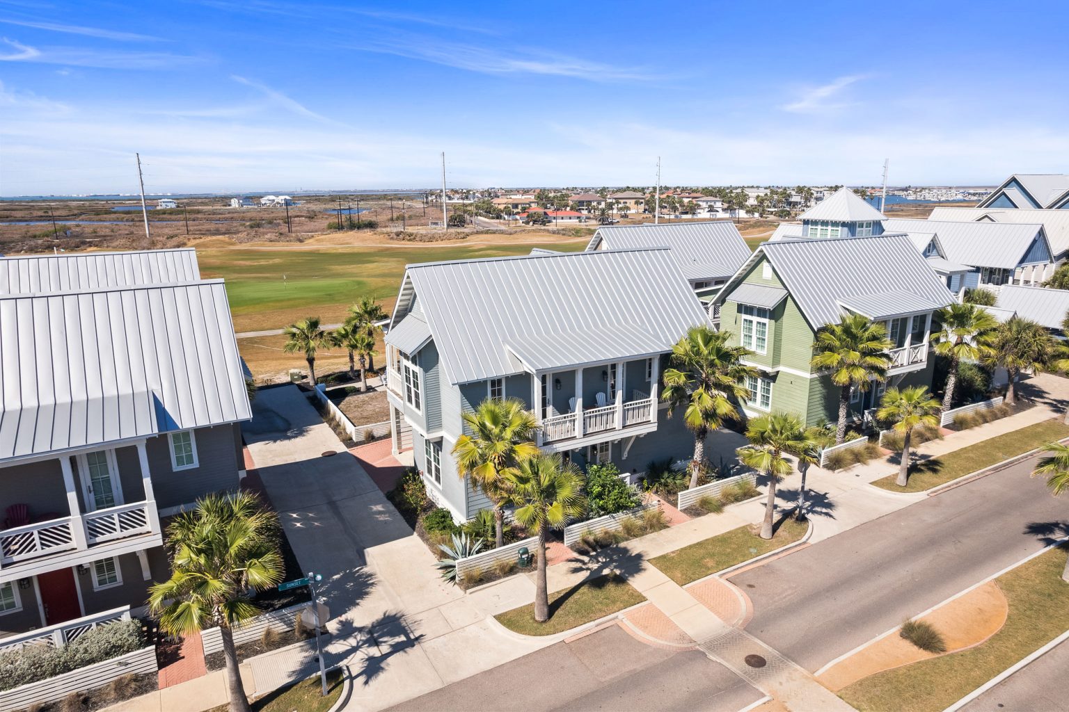Aerial view of 200 Sunset Avenue and neighboring homes toward the golf course
