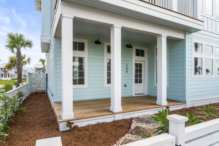 Covered front porch with white columns at 209 Horse Tail Lane