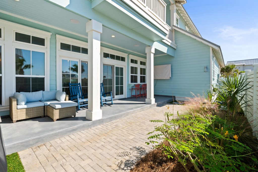 Covered back patio with outdoor seating at 724 Sunset Avenue