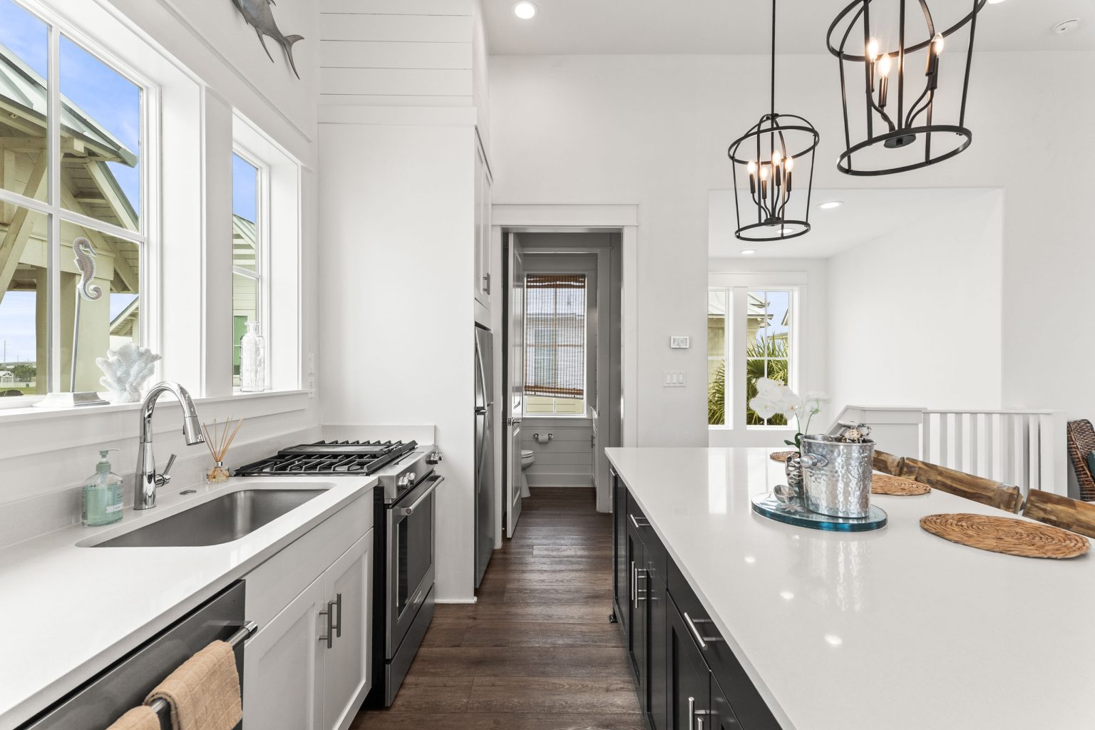 Galley kitchen with gas range and white quartz counters at 214 Sunset Avenue #5