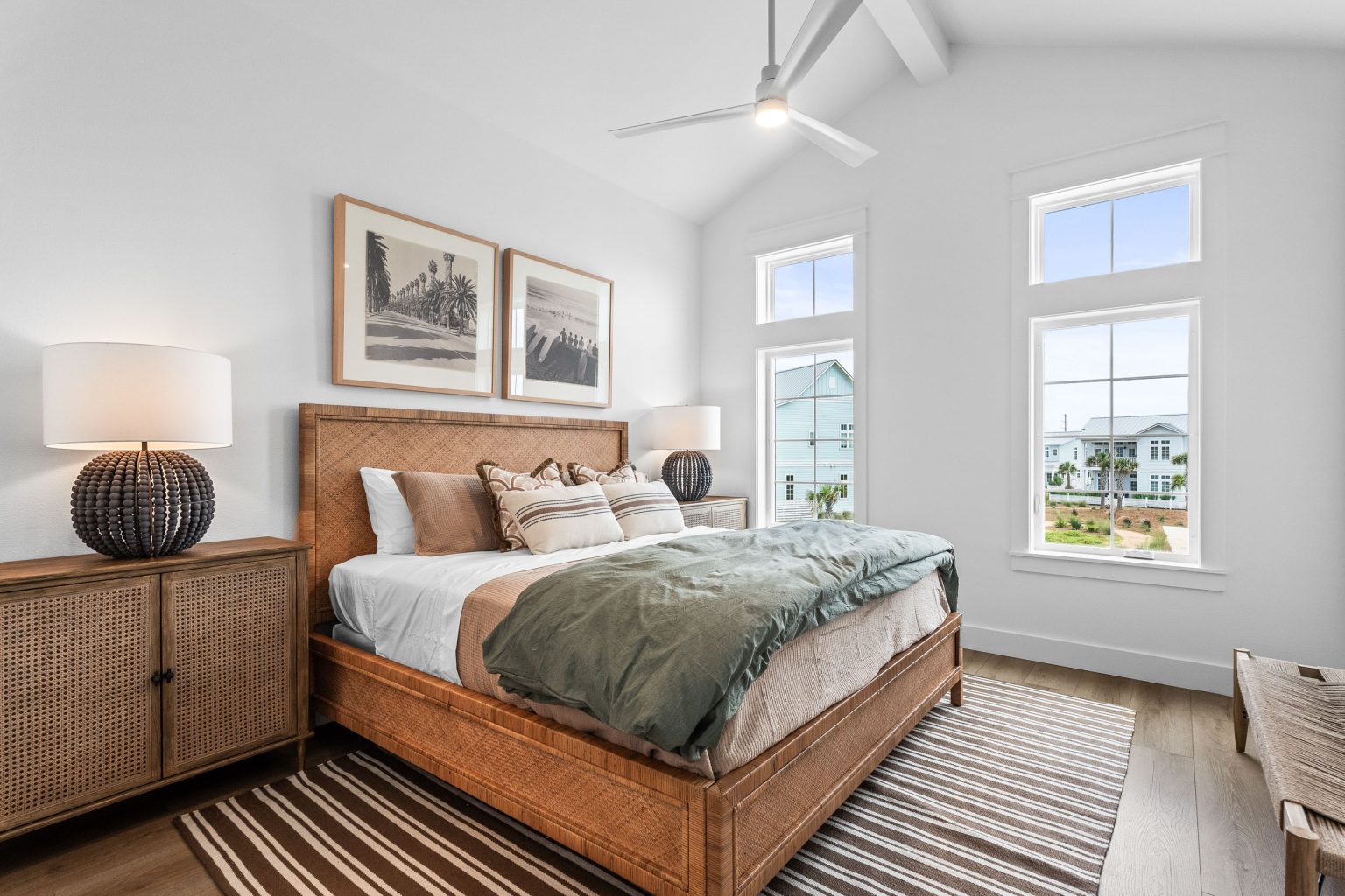 Bedroom with a wood bed and framed prints at 209 Horse Tail Lane
