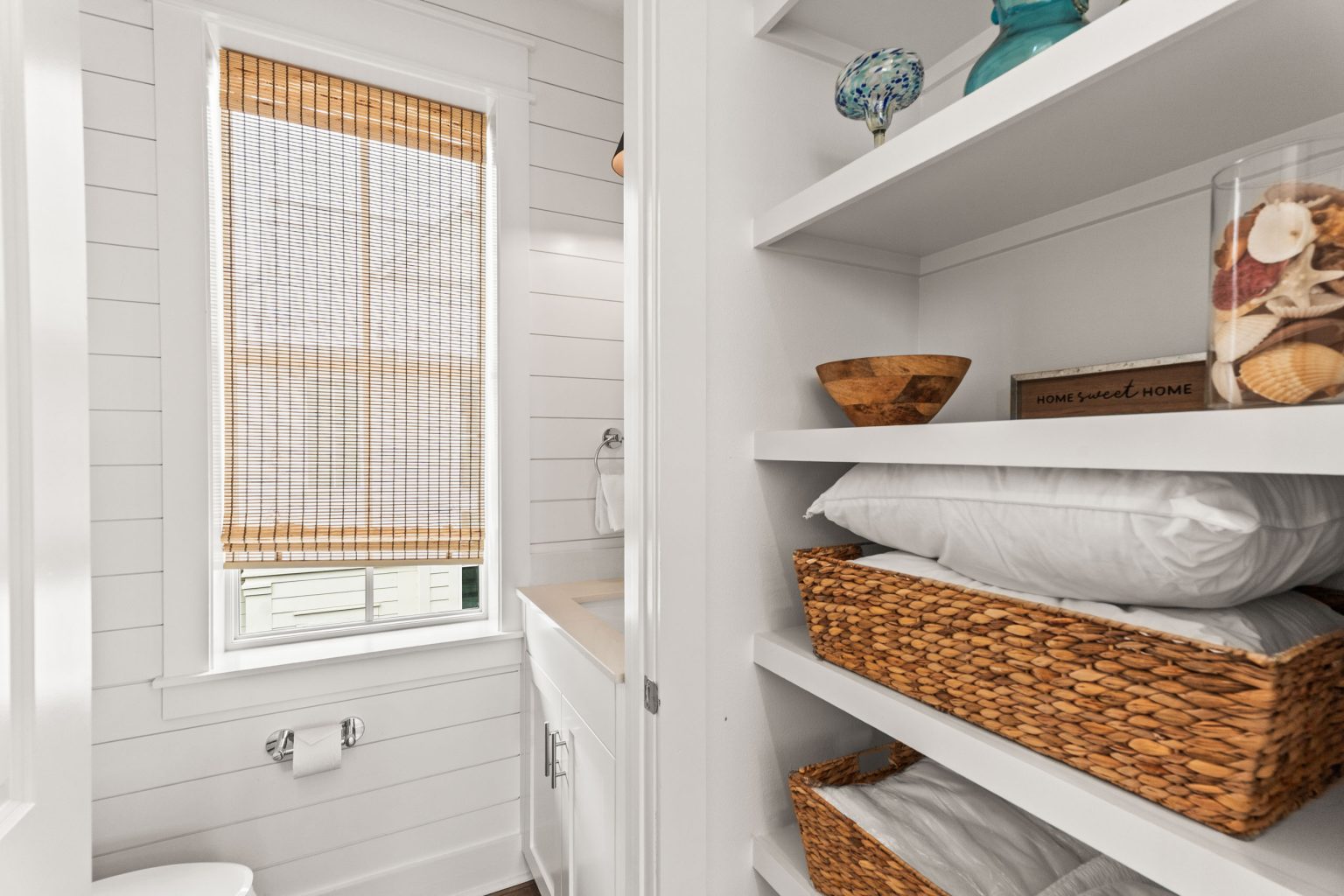 Built-in linen shelves with baskets at 214 Sunset Avenue #5