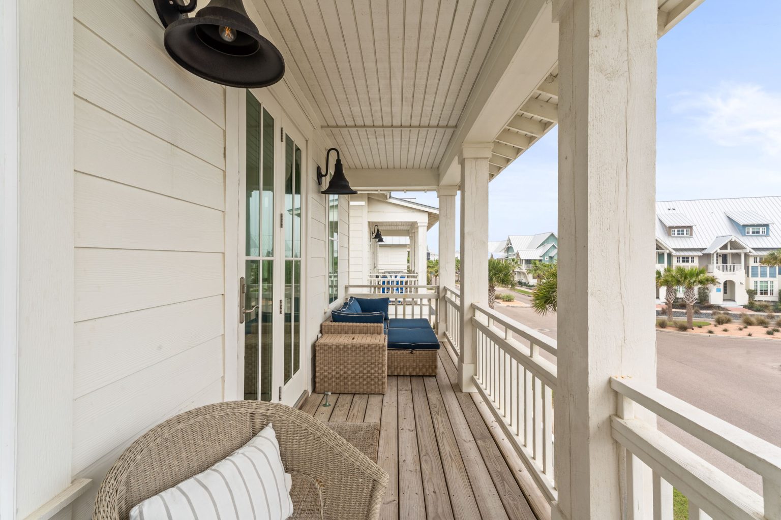 Covered front porch with wicker seating at 214 Sunset Avenue #5