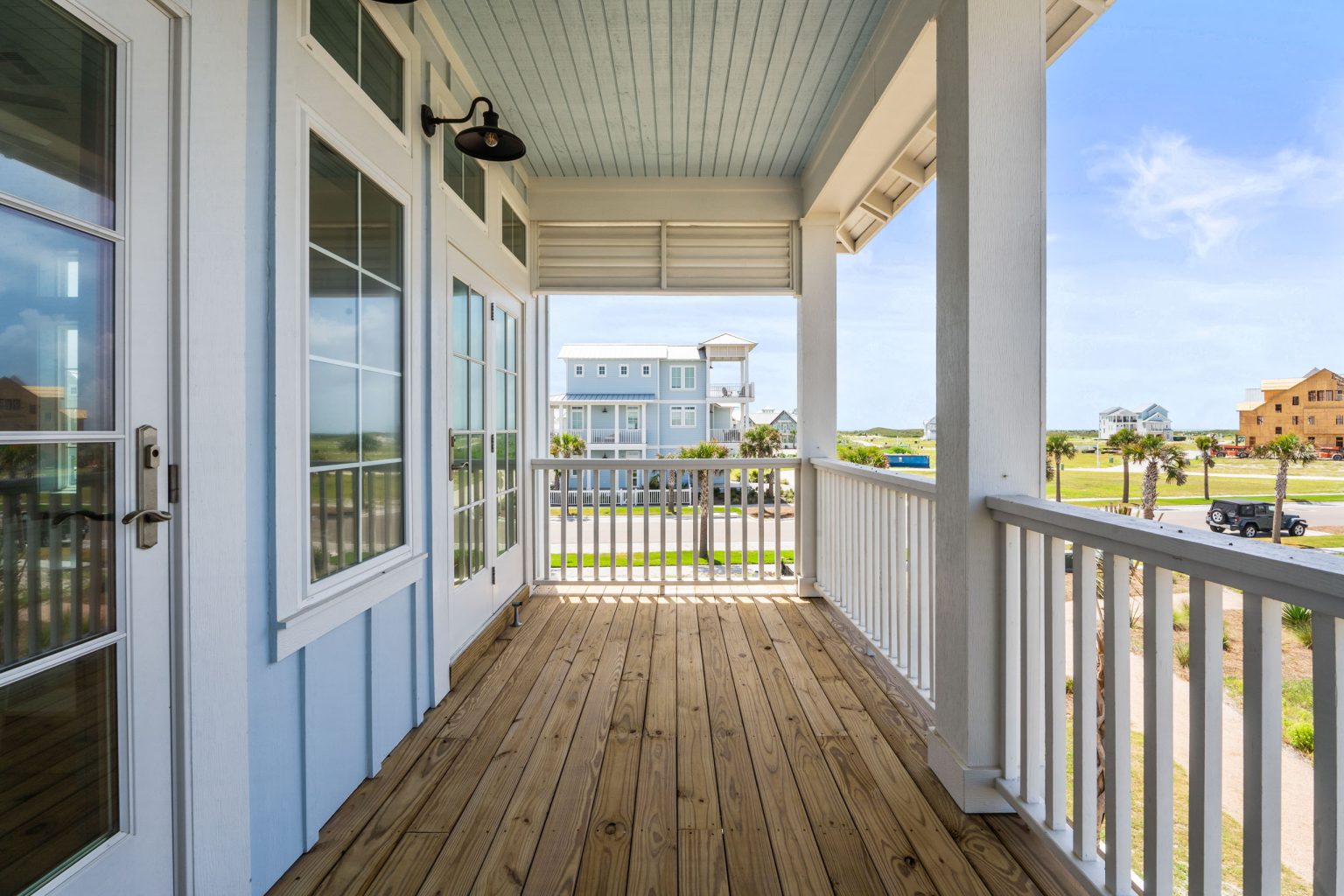 Covered upper porch with wood decking at 205 Horse Tail Lane