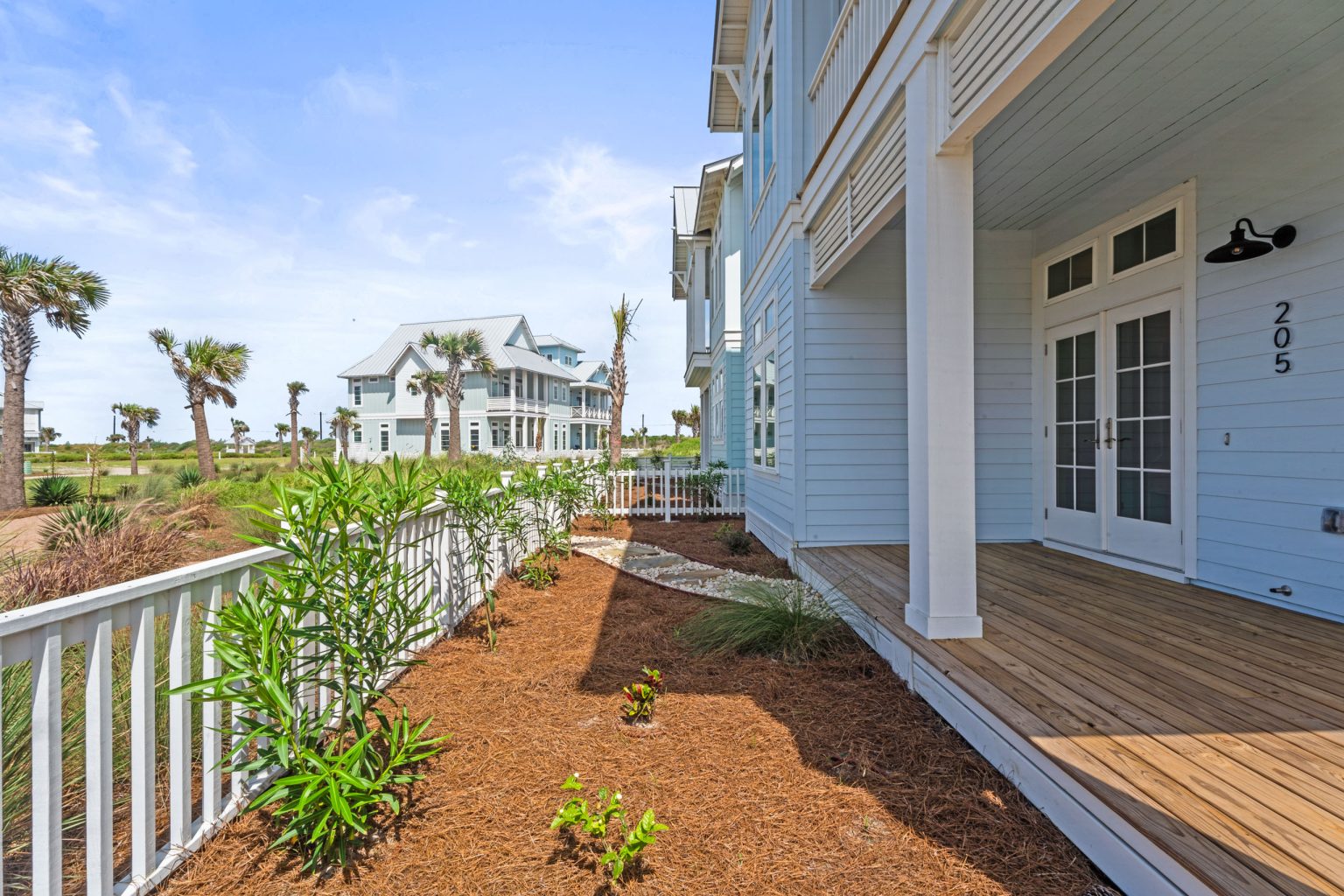 Side porch and landscaped yard at 205 Horse Tail Lane