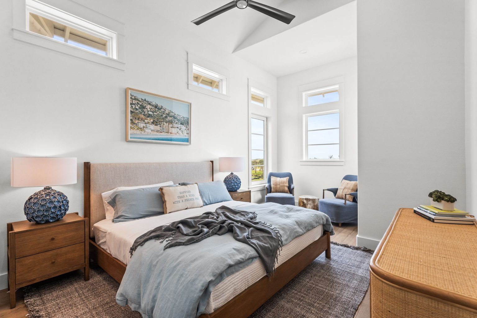 Bedroom with a wood bed and sitting area at 120 Lotus Lane