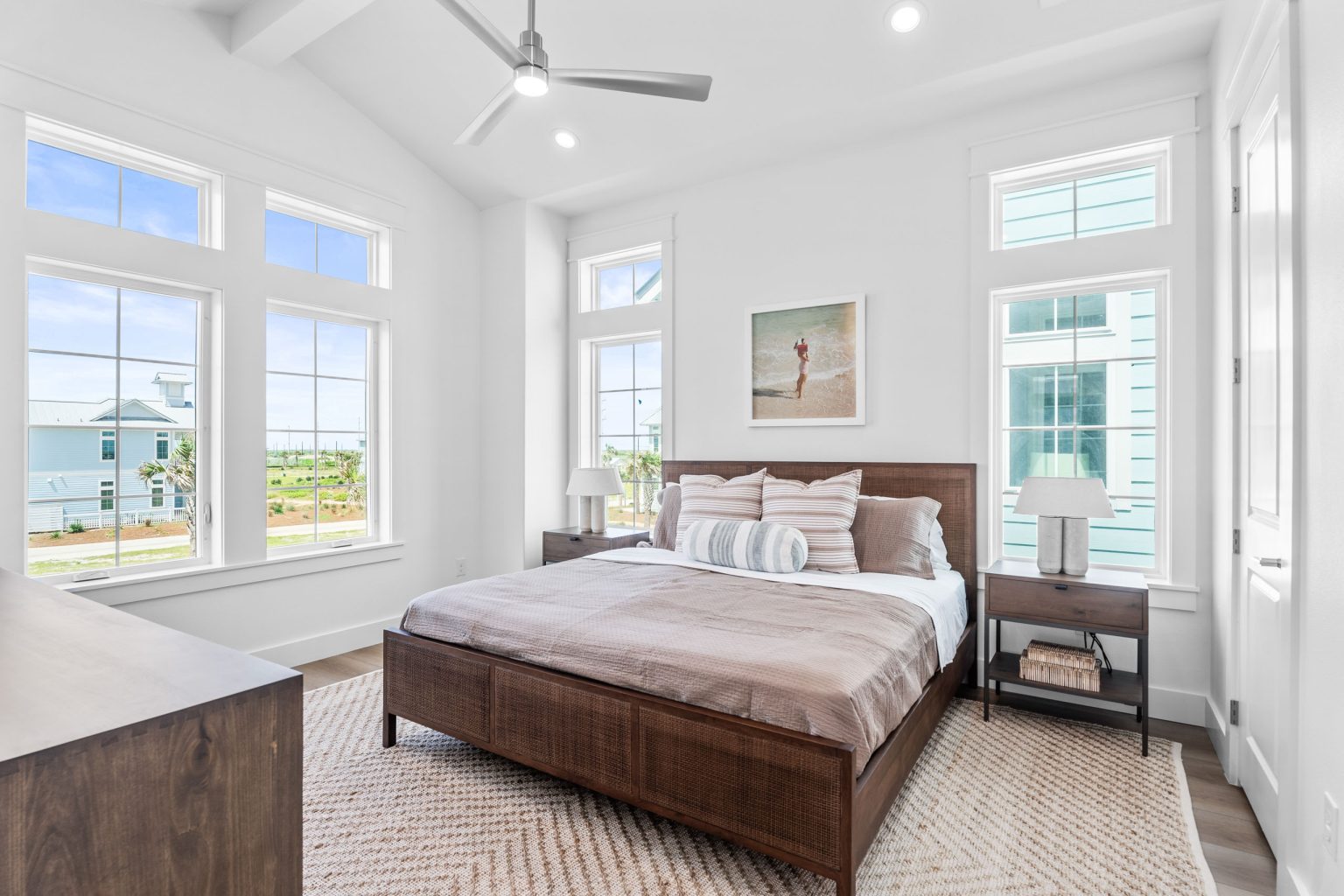 Bedroom with a wood bed and vaulted ceiling at 205 Horse Tail Lane