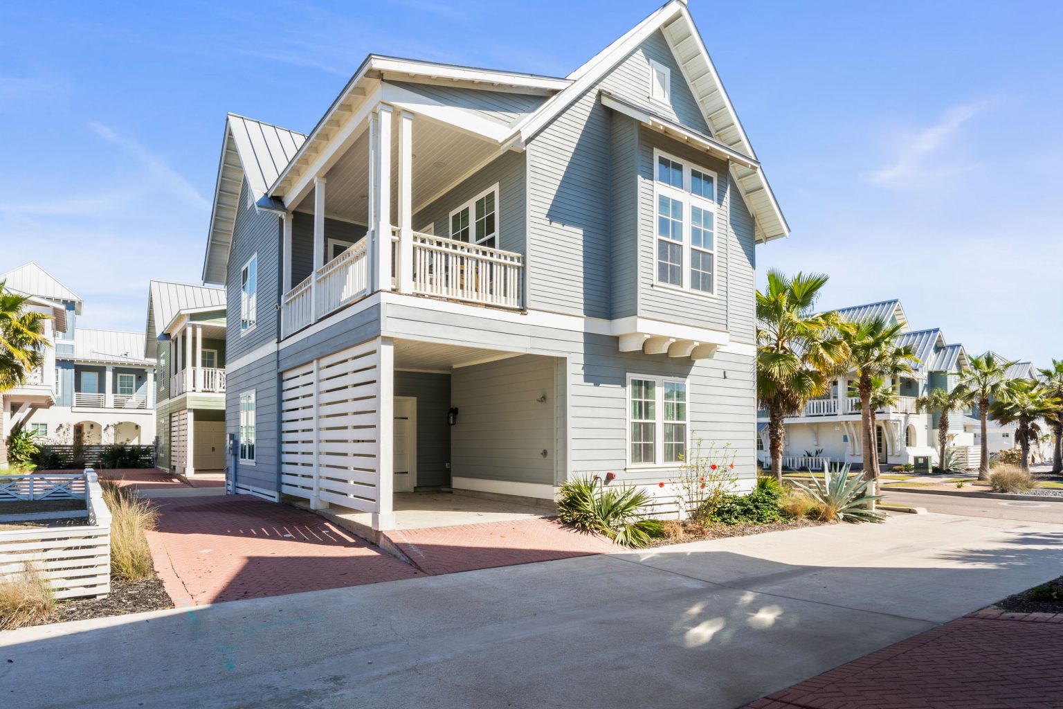 Exterior of 200 Sunset Avenue with covered balconies and a drive-under garage