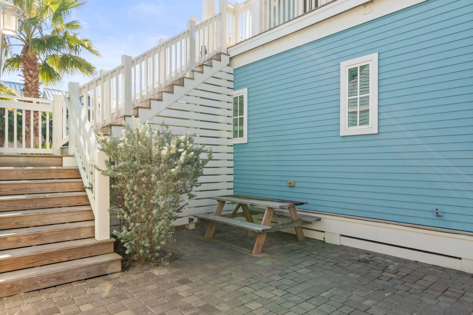 Back patio and exterior stairs at 152 Sea Rocket Lane