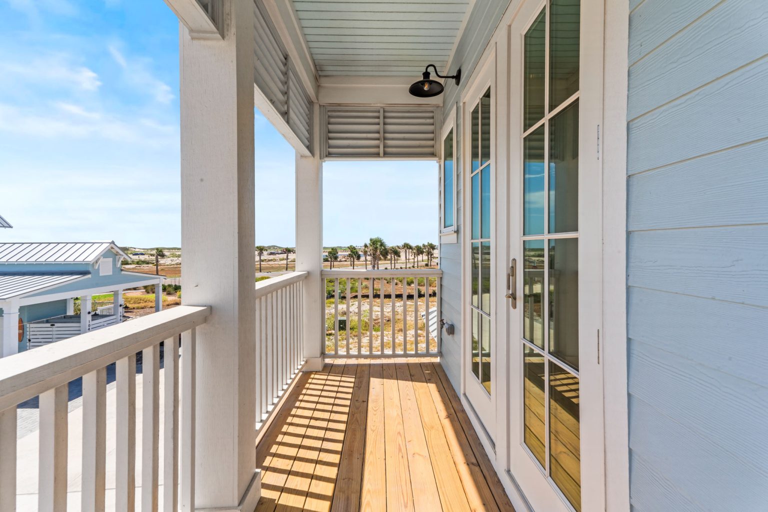 Covered porch with wood decking at 101 Sea Whip Lane