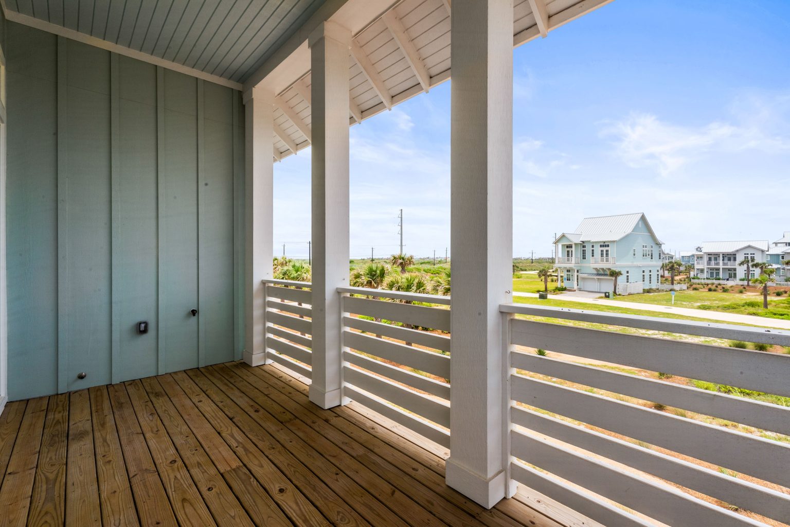 Upper porch with views of neighboring homes at 120 Lotus Lane