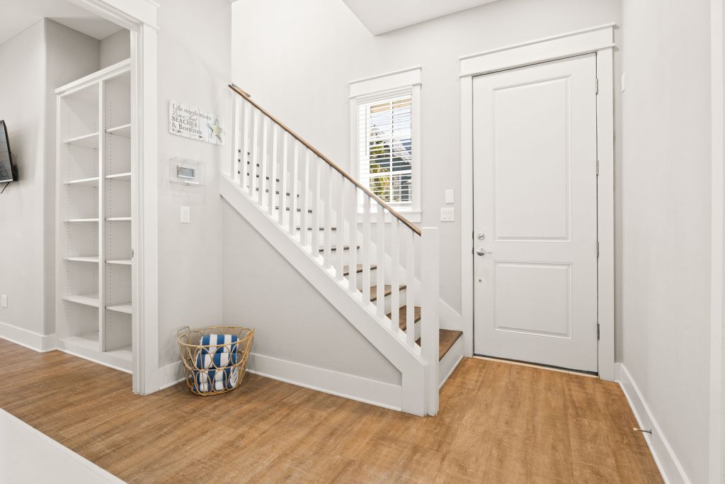 Entry hall with staircase and built-in shelves at 200 Sunset Avenue