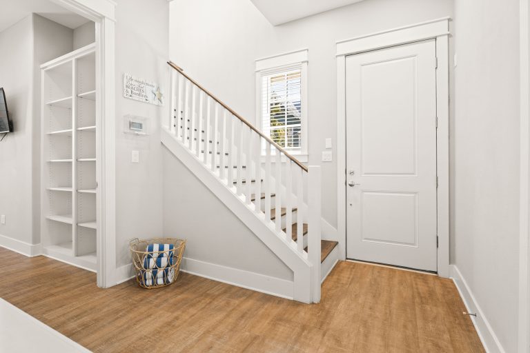 Entry hall with staircase and built-in shelves at 200 Sunset Avenue