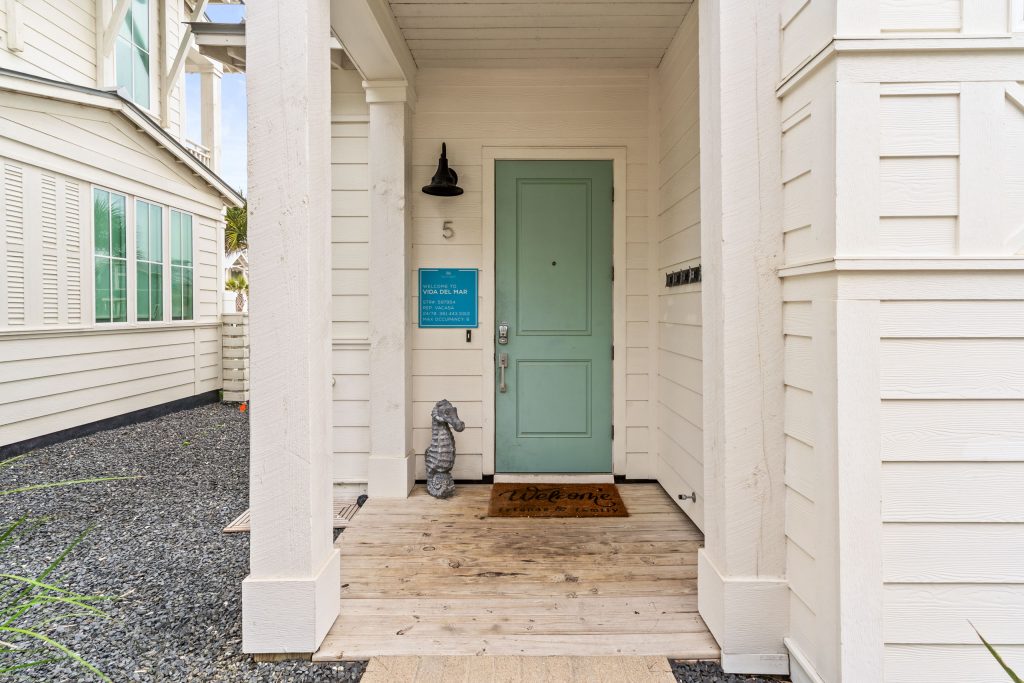 Front entry with a sea-green door at 214 Sunset Avenue #5