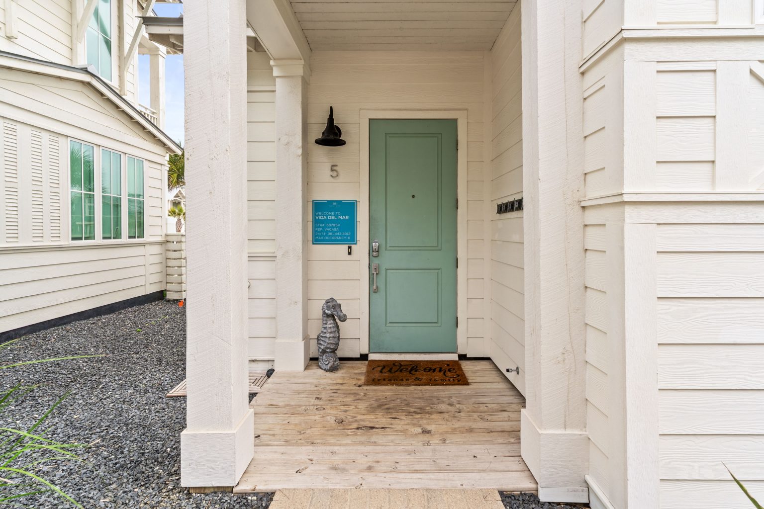 Front entry with a sea-green door at 214 Sunset Avenue #5