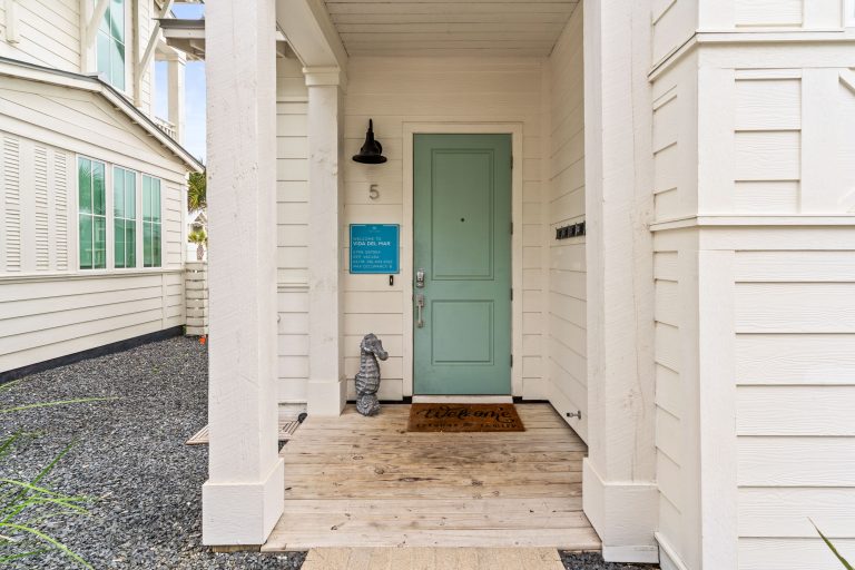 Front entry with a sea-green door at 214 Sunset Avenue #5