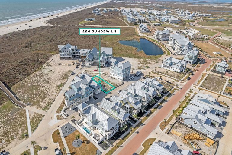 Aerial view marking the 224 Sundew Lane homesite near a pond and the beach