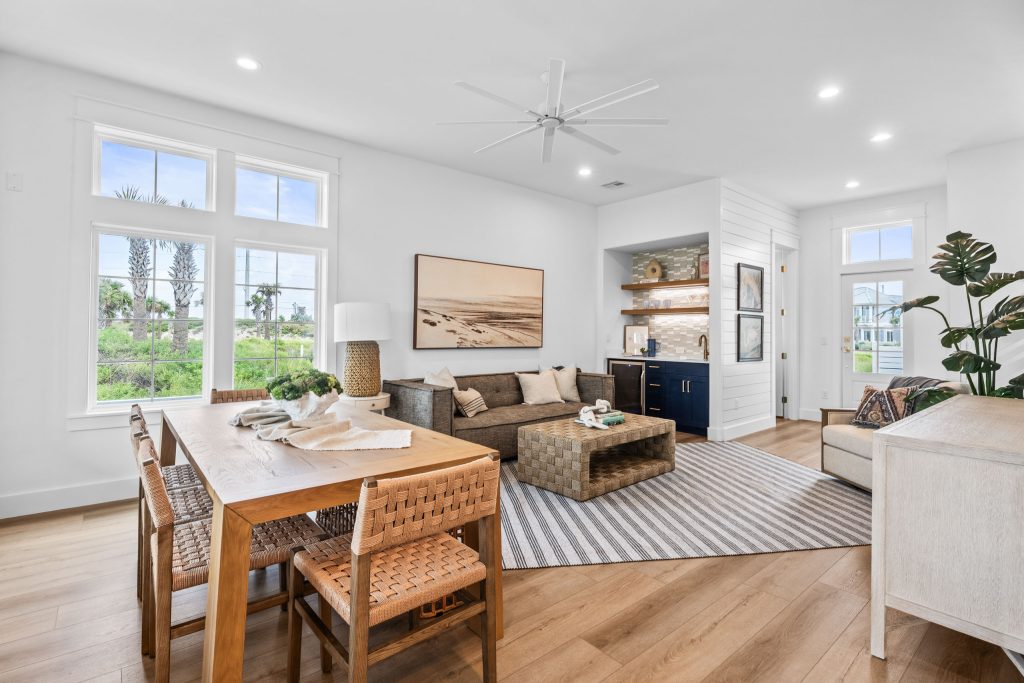 Open dining and living area with large windows at 209 Horse Tail Lane
