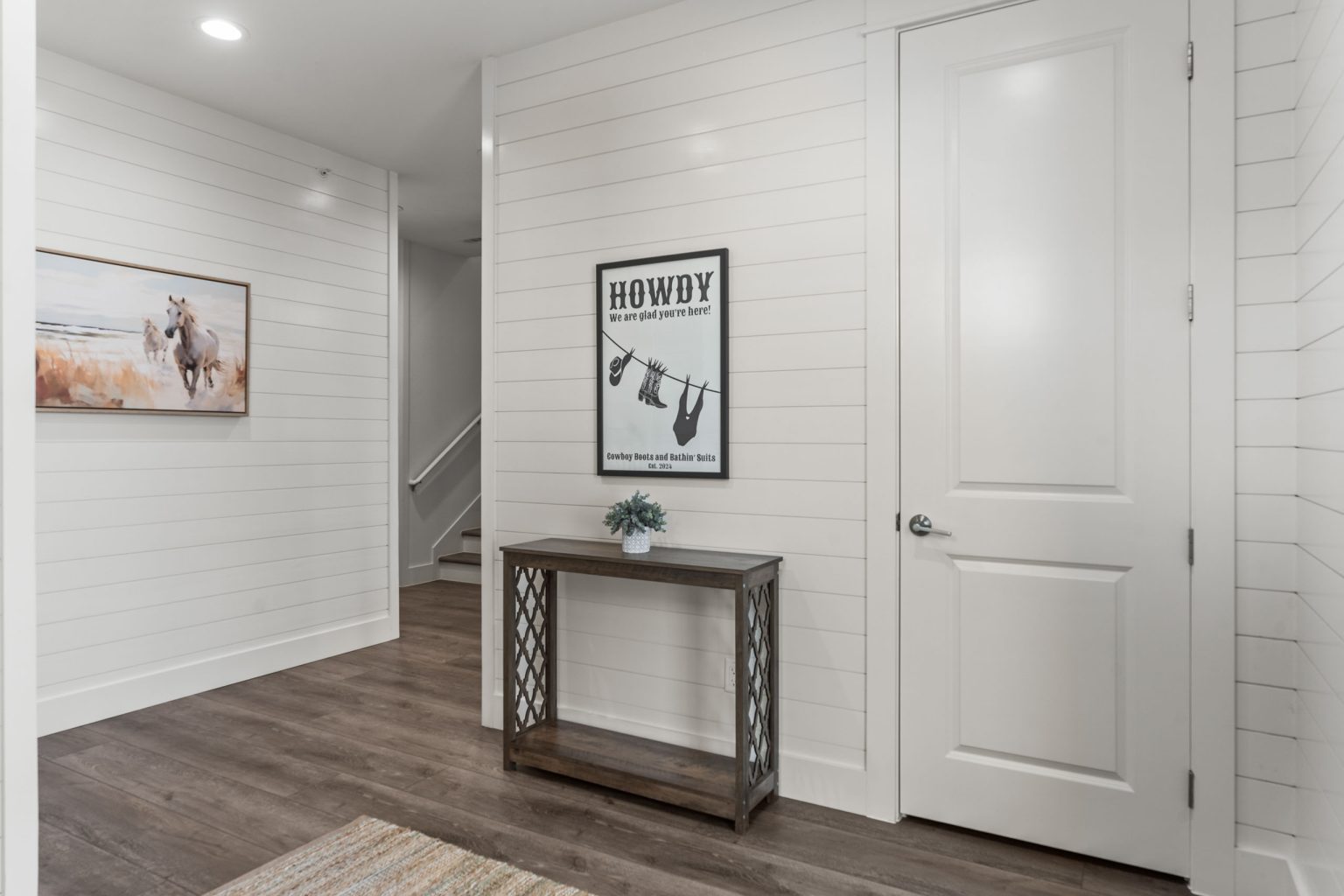 Ground-floor entry hall with shiplap walls at 250 Sunrise Avenue
