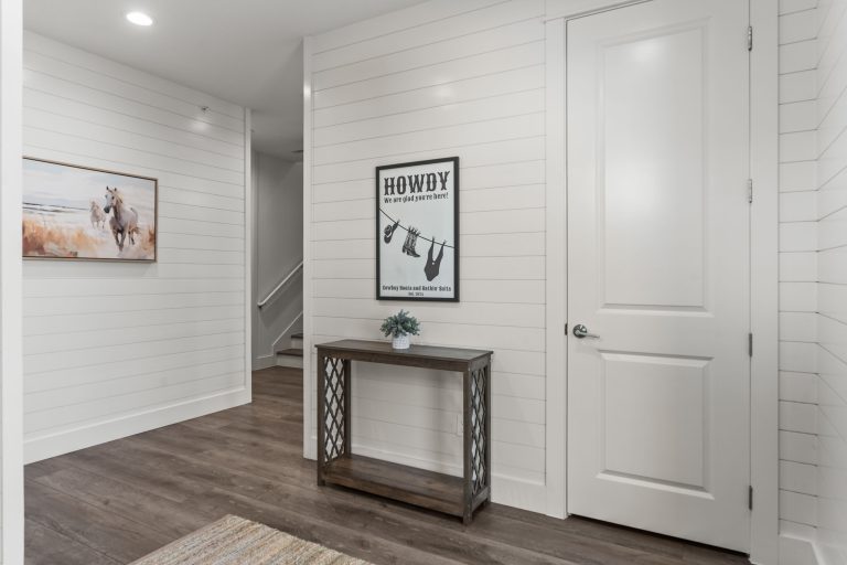Ground-floor entry hall with shiplap walls at 250 Sunrise Avenue