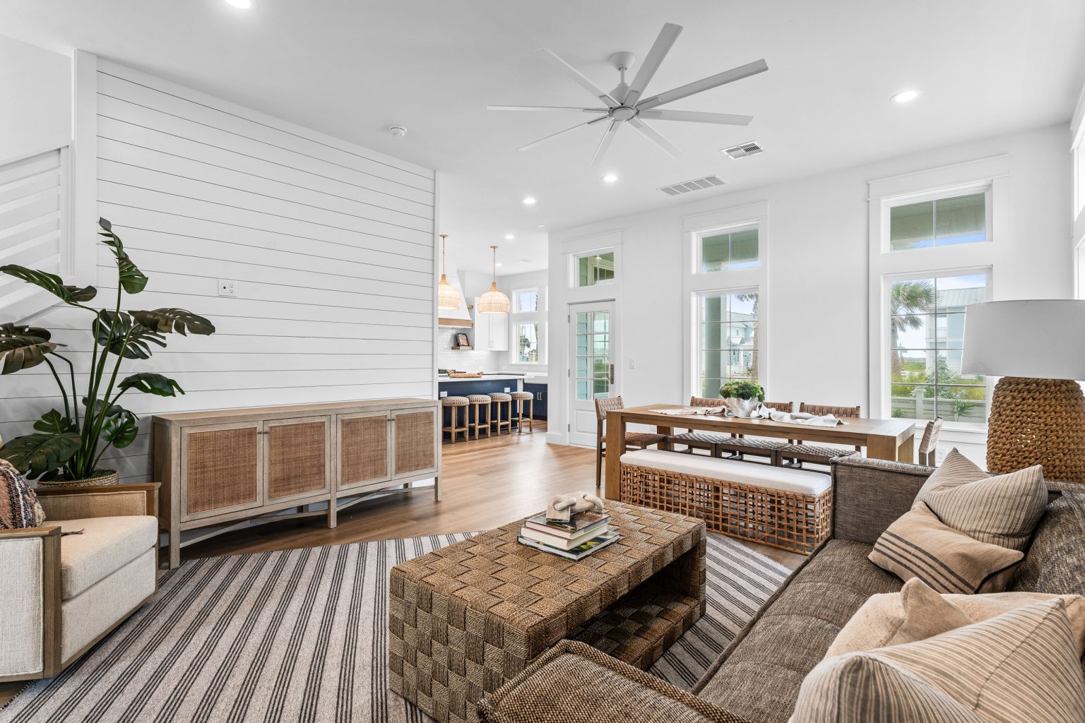 Living room with a striped rug and woven coffee table at 209 Horse Tail Lane