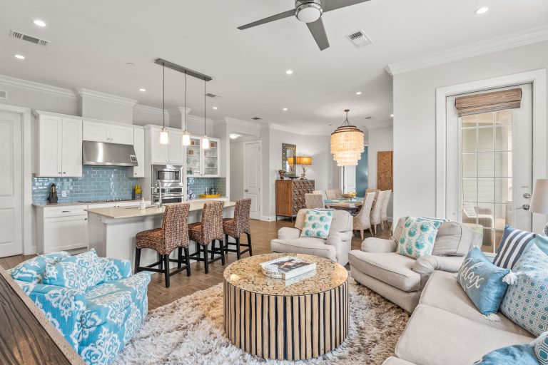 Living room with turquoise accents open to the kitchen at 137 Palmilla Circle #204