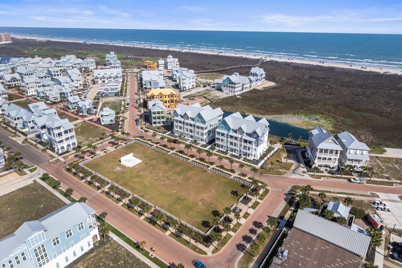 Aerial view of 250 Sunrise Avenue near the green and the beach