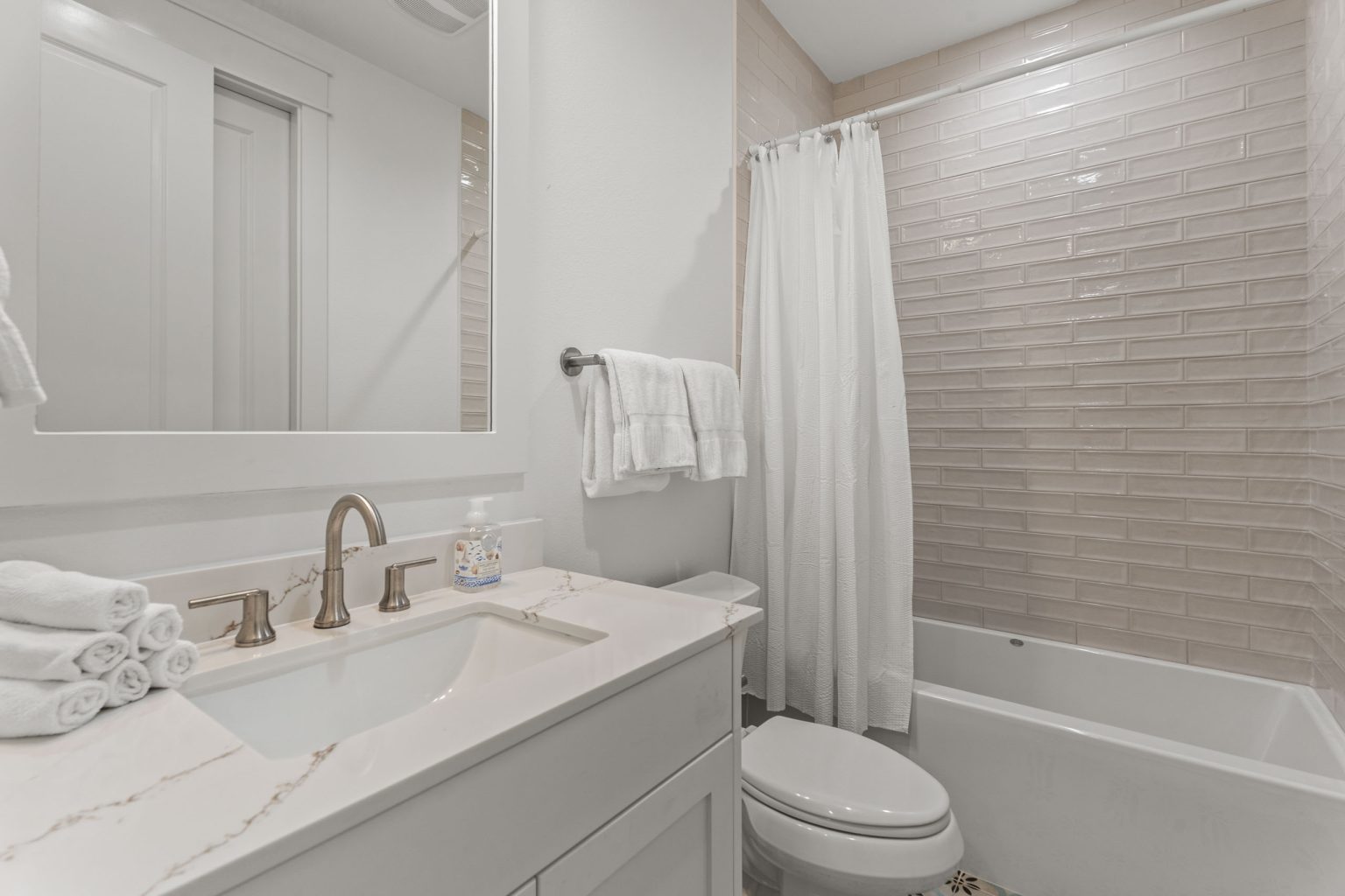 Bathroom with quartz vanity and tub-shower at 250 Sunrise Avenue