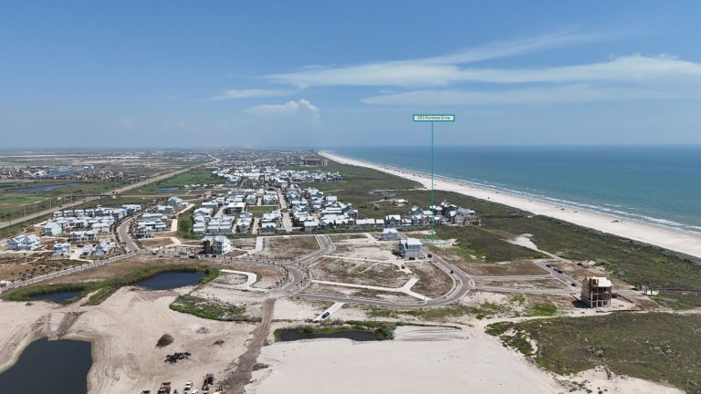 Aerial view marking the beachfront 333 Purslane Drive homesite at Palmilla Beach