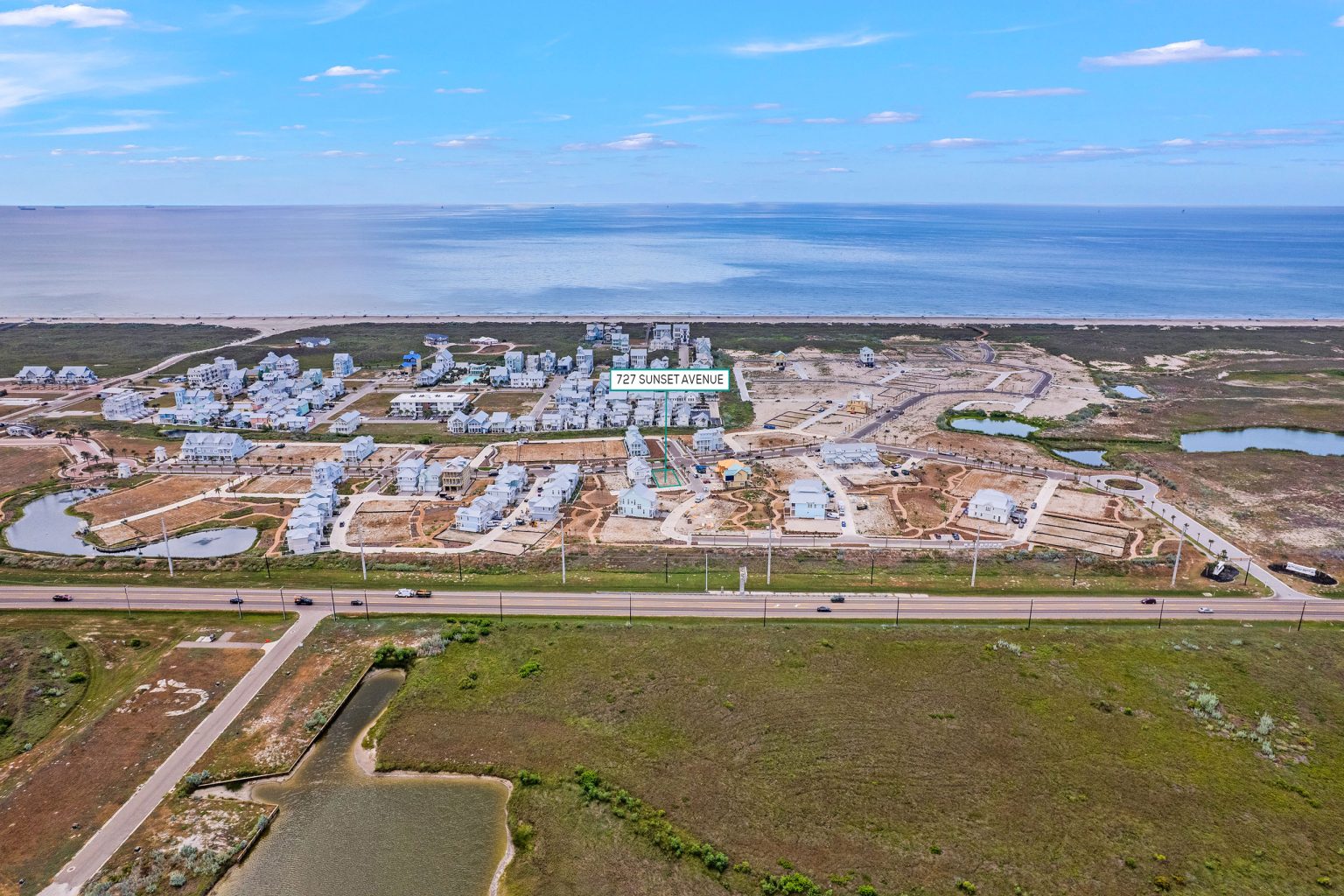 Aerial view marking the 727 Sunset Avenue homesite at Palmilla Beach near the Gulf