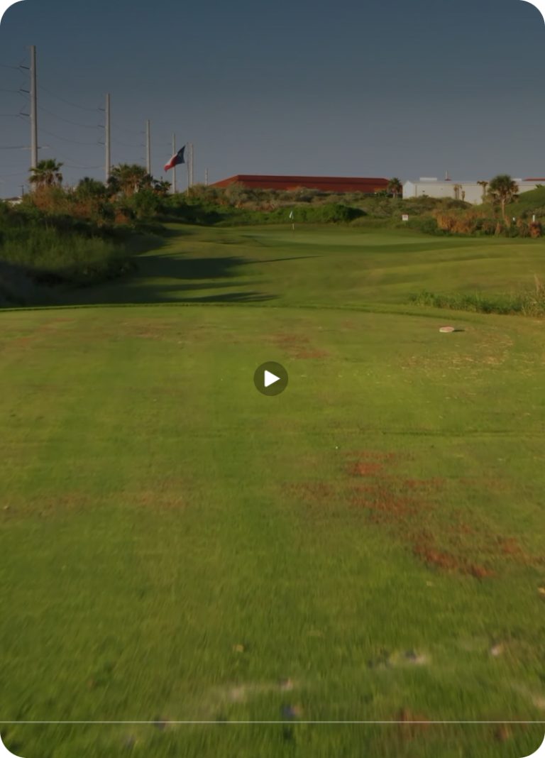 A fairway on the Palmilla Beach golf course seen from a low-flying drone