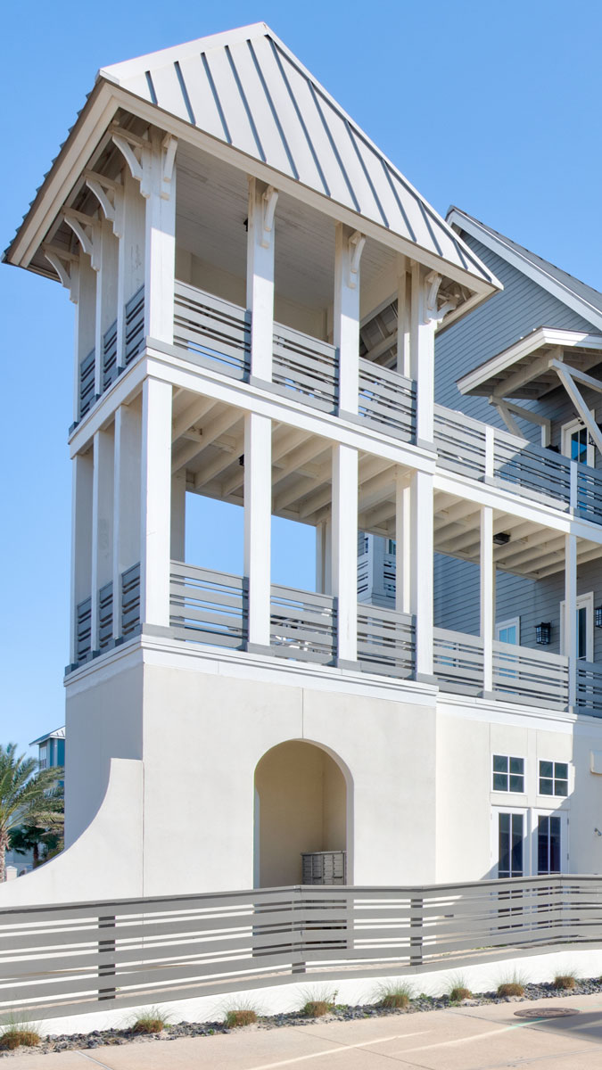 White coastal townhomes with spacious balconies